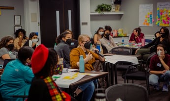 people sitting in a meeting