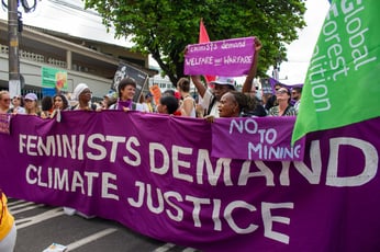 Feminists demanding climate justice at the People's March at COP30. Photo by Ariana Rodriguez-Gitler