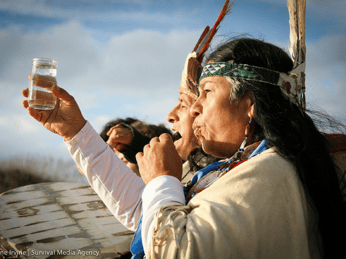 a group of indigenous people at a protest